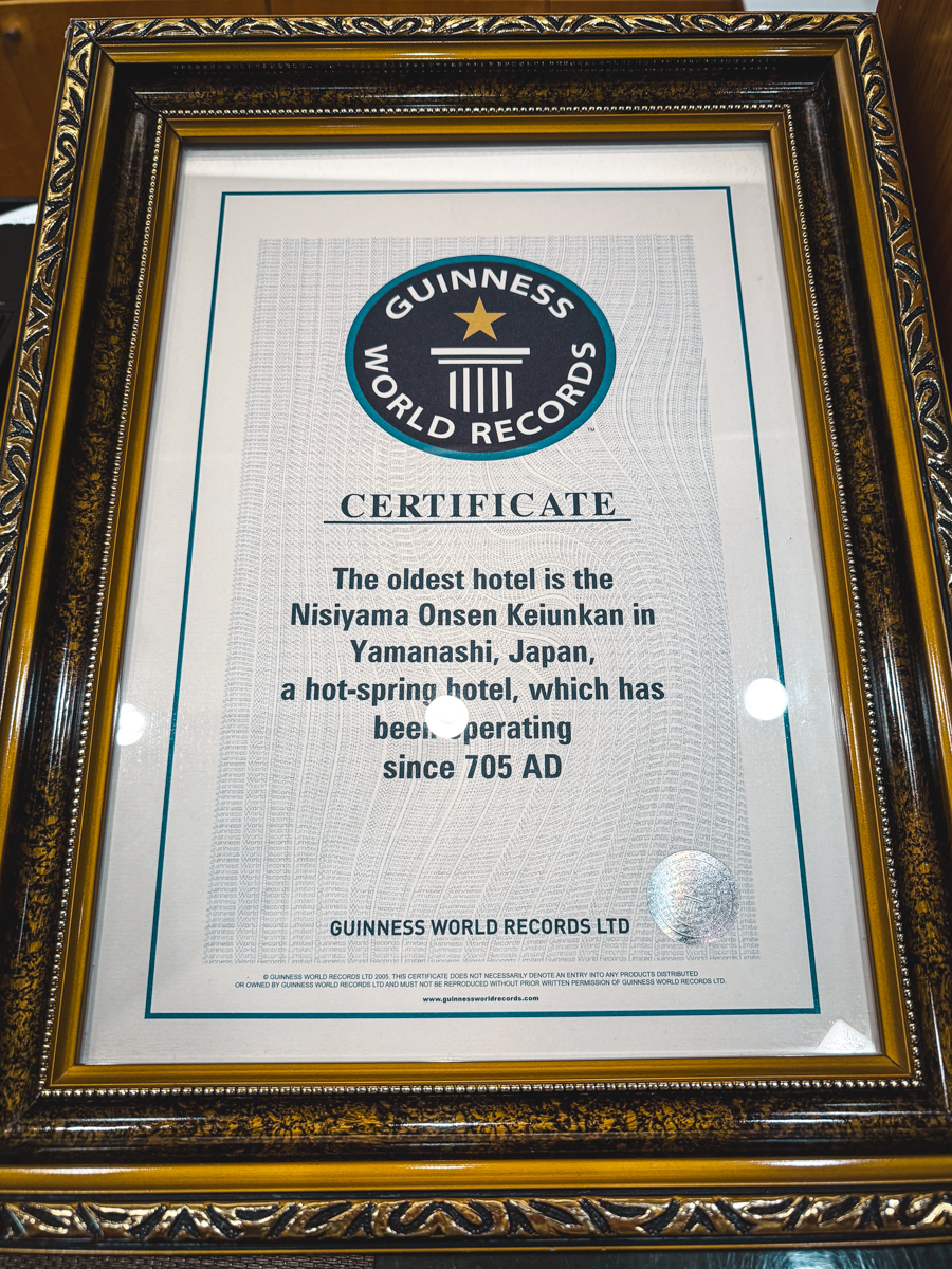 Guinness World Record Plaque awarded to Nishiyama Onsen as the world's oldest hotel, dating to 705AD.