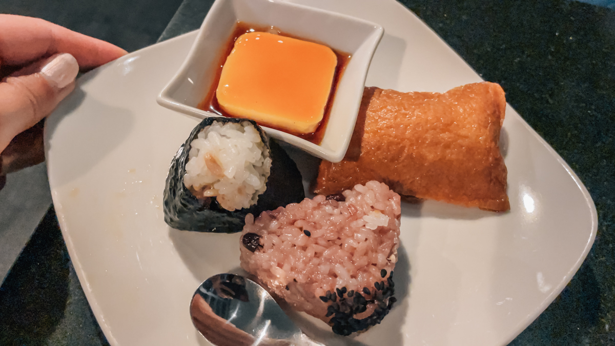 Plate of onigiri, inari, and dulce de leche.