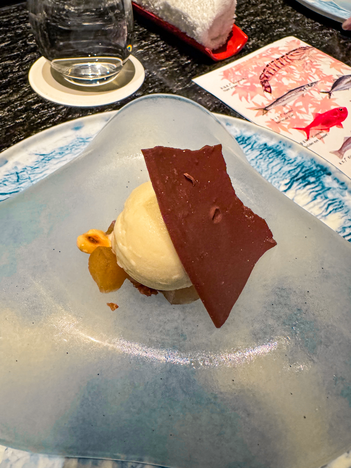 Kinkako ice cream with a piece of chocolate.