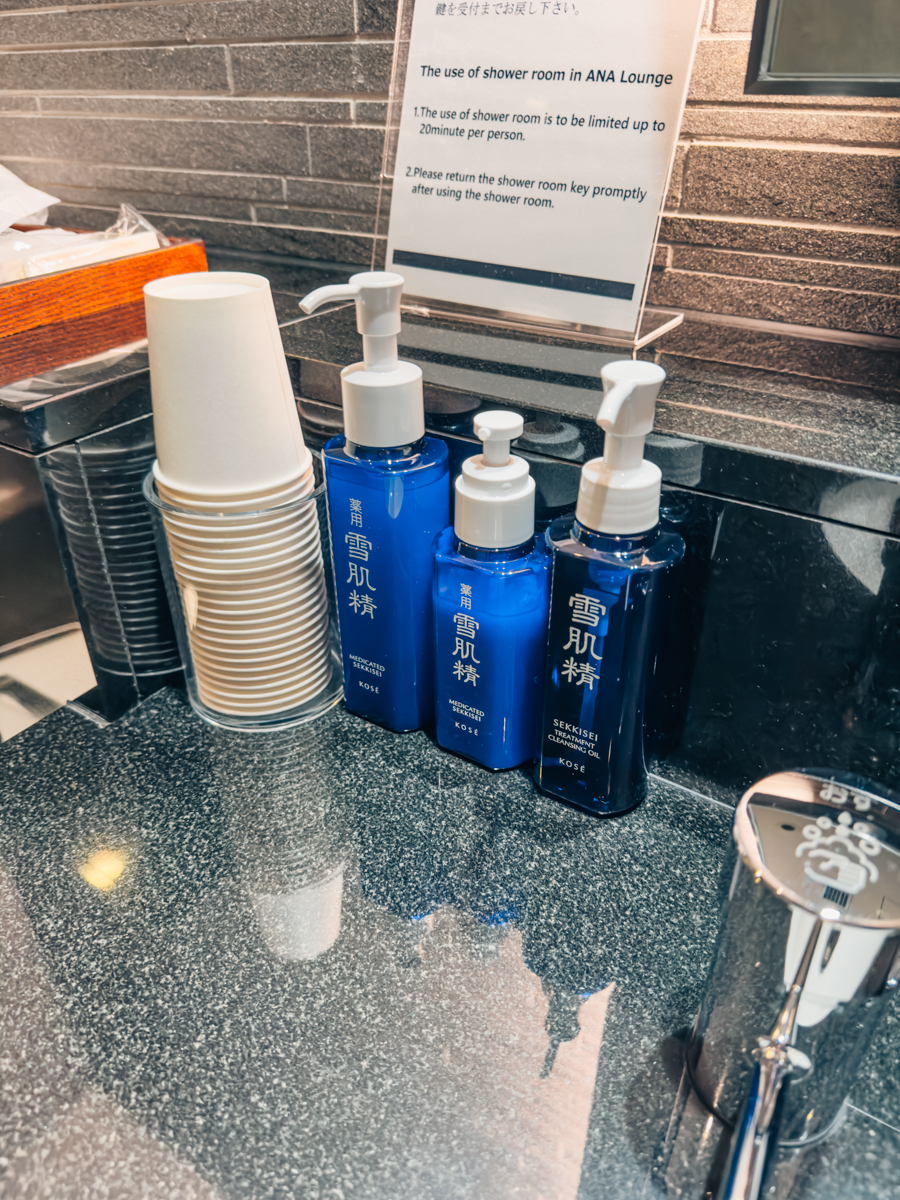 KOSE SEKKISEI moisturizers and cleanser in blue bottles.
