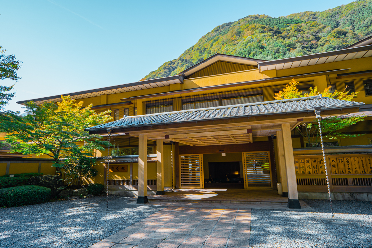 Nishiyama Onsen front facia with mountain and trees in background.
