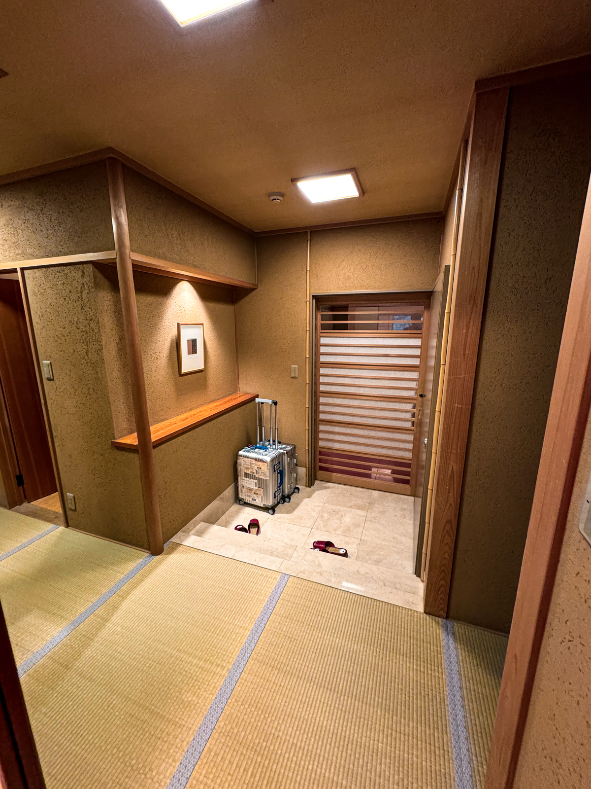 Entrance with a step leading to tatami mats.